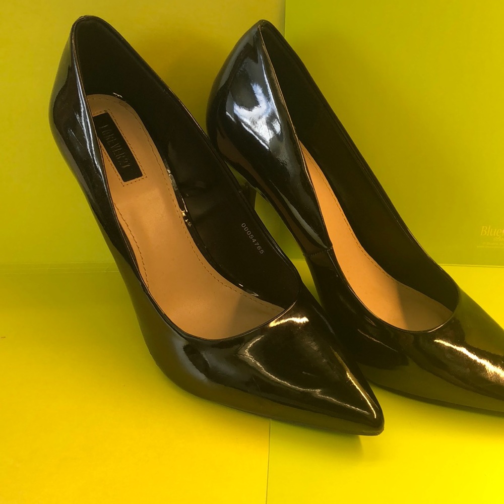 Black patent leather pumps.